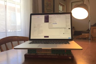 Open Laptop with lighting lamp behind